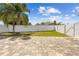 Spacious backyard featuring lush green lawn and a newly-constructed, white vinyl fence at 7466 Jonquil Pl, Weeki Wachee, FL 34607