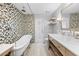 Charming bathroom featuring a clawfoot tub and stylish mosaic tile accent wall at 7466 Jonquil Pl, Weeki Wachee, FL 34607