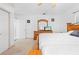 A bedroom featuring a decorative wood bed frame and access to the outdoors at 7466 Jonquil Pl, Weeki Wachee, FL 34607