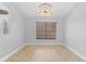 Cozy dining room featuring a decorative light fixture and natural light at 7466 Jonquil Pl, Weeki Wachee, FL 34607