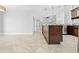 Spacious kitchen island with granite countertops and dark wood cabinetry at 7466 Jonquil Pl, Weeki Wachee, FL 34607