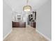 Open-concept kitchen with an island, stainless steel appliances, and dark wood cabinets at 7466 Jonquil Pl, Weeki Wachee, FL 34607