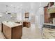 A renovated kitchen with granite counters and stylish pendant lighting fixtures at 7466 Jonquil Pl, Weeki Wachee, FL 34607