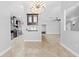 Open-concept living area with views into the kitchen, featuring tile floors and a decorative light at 7466 Jonquil Pl, Weeki Wachee, FL 34607