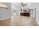 Open living area featuring tile floors, neutral walls and open layout leading to kitchen and entry way at 7466 Jonquil Pl, Weeki Wachee, FL 34607