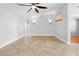 Open and airy living room featuring tile floors and stylish wall sconces at 7466 Jonquil Pl, Weeki Wachee, FL 34607