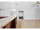 A spacious living area with tile floors and access to a bright, naturally-lit room at 7466 Jonquil Pl, Weeki Wachee, FL 34607