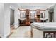 Bathroom with granite countertops, soaking tub, and a vanity with dual sinks at 7466 Jonquil Pl, Weeki Wachee, FL 34607