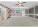 Large main bedroom with tray ceilings, a ceiling fan, and decorative wall trim at 7466 Jonquil Pl, Weeki Wachee, FL 34607