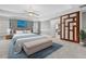 Luxurious main bedroom with tray ceilings, soft lighting, and custom wall accents at 7466 Jonquil Pl, Weeki Wachee, FL 34607