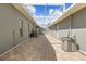Covered outdoor patio with brick flooring, providing a perfect space for relaxation and entertainment at 7466 Jonquil Pl, Weeki Wachee, FL 34607