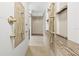 Walk-in shower with dual shower heads, neutral tile, and built-in bench at 7466 Jonquil Pl, Weeki Wachee, FL 34607