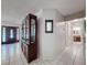Inviting entryway boasting tile flooring and a decorative display cabinet at 7700 Fairlawn Dr, Hudson, FL 34667