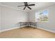 Well-lit bedroom with a modern fan and large window at 8240 Gulf Way, Hudson, FL 34667