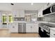 Updated kitchen with stainless steel appliances and tile backsplash at 8240 Gulf Way, Hudson, FL 34667
