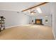 Spacious living room featuring tile floors, a fireplace, and skylights at 8240 Gulf Way, Hudson, FL 34667