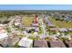 Aerial view showcases the property among well-kept homes and landscaping at 8523 Regal Ln, Hudson, FL 34667