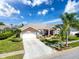 Expansive aerial view of a lovely home featuring a starburst driveway and beautifully landscaped front yard at 8523 Regal Ln, Hudson, FL 34667