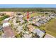 Aerial view of a residential neighborhood with houses and green spaces at 8523 Regal Ln, Hudson, FL 34667