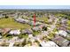 Aerial view shows property surrounded by a lush residential neighborhood at 8523 Regal Ln, Hudson, FL 34667