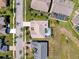 Aerial view of a neighborhood featuring a house with a screened-in pool at 8523 Regal Ln, Hudson, FL 34667