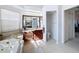 An elegant bathroom with dual sinks, a soaking tub, and a separate toilet area at 8523 Regal Ln, Hudson, FL 34667