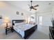 Cozy bedroom featuring a ceiling fan and neutral colors to create a relaxing atmosphere at 8523 Regal Ln, Hudson, FL 34667