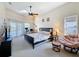 Spacious bedroom with a ceiling fan, offering a relaxing retreat for rest and rejuvenation at 8523 Regal Ln, Hudson, FL 34667