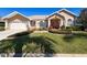 Beautiful single-story home with well-manicured lawn and a two-car garage at 8523 Regal Ln, Hudson, FL 34667
