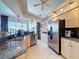 Modern kitchen with stainless steel appliances, granite countertops, and neutral cabinets at 8523 Regal Ln, Hudson, FL 34667