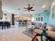 Open concept living space features tile floors, neutral colors, modern decor, and plenty of natural light at 8523 Regal Ln, Hudson, FL 34667