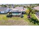 Screened-in pool and well-maintained yard of a comfortable home at 8523 Regal Ln, Hudson, FL 34667