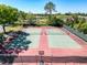 Overhead view of outdoor tennis courts highlighting recreational opportunity at 8523 Regal Ln, Hudson, FL 34667
