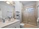 Bathroom featuring marble vanity, shower-tub combo with etched heron detail at 9159 Trevino Dr, Weeki Wachee, FL 34613