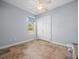 Simple bedroom with tile flooring, a window, and a double-door closet at 9159 Trevino Dr, Weeki Wachee, FL 34613