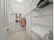 Walk-in closet with custom shelving, ample storage space, and organized layout at 9159 Trevino Dr, Weeki Wachee, FL 34613