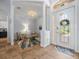 A welcoming foyer features tile flooring, a decorative light fixture, and an inviting seating area at 9159 Trevino Dr, Weeki Wachee, FL 34613
