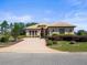 Charming home with brick driveway, landscaped garden, and inviting entryway offers great curb appeal at 9159 Trevino Dr, Weeki Wachee, FL 34613