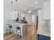 The kitchen boasts modern cabinetry, stainless steel appliances, and stylish countertops with breakfast bar seating area at 9159 Trevino Dr, Weeki Wachee, FL 34613