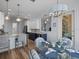 A spacious kitchen features stainless steel appliances, ample storage, and a pass-through window, connecting to the dining area at 9159 Trevino Dr, Weeki Wachee, FL 34613
