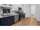 A modern kitchen features stainless steel appliances, sleek countertops, and ample cabinet space, creating a functional design at 9159 Trevino Dr, Weeki Wachee, FL 34613