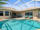 Sparkling pool with adjacent patio seating and inviting outdoor space at 9159 Trevino Dr, Weeki Wachee, FL 34613