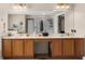 Bright bathroom with double vanity, framed mirror and great lighting at 951 Nodding Shade Dr, Brooksville, FL 34604
