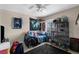 Bedroom featuring a bed, ceiling fan, and window, creating a comfortable and bright space for rest and relaxation at 951 Nodding Shade Dr, Brooksville, FL 34604
