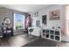 A well lit living room featuring a gray brick wall and hard surface floors at 951 Nodding Shade Dr, Brooksville, FL 34604