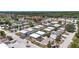 An aerial view with marker of a community with several condos, mature trees, and beautiful landscaping at 9811 Hidden Ln # 2, Port Richey, FL 34668