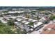 Aerial view with marker showcasing a well-maintained neighborhood with condos and mature trees at 9811 Hidden Ln # 2, Port Richey, FL 34668