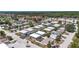 An aerial view of a community with several condos, mature trees, and beautiful landscaping at 9811 Hidden Ln # 2, Port Richey, FL 34668