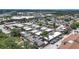 Aerial view showcasing a well-maintained neighborhood with condos and mature trees at 9811 Hidden Ln # 2, Port Richey, FL 34668