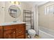 Bathroom with wood vanity, ceramic tile and modern fixtures at 9811 Hidden Ln # 2, Port Richey, FL 34668
